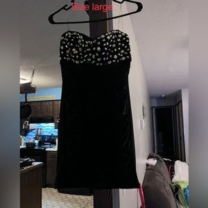 Black form fitting dress with rhinestones